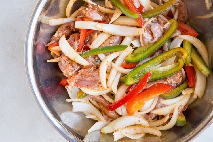 Toss the ingredients for the fajitas together in a mixing bowl