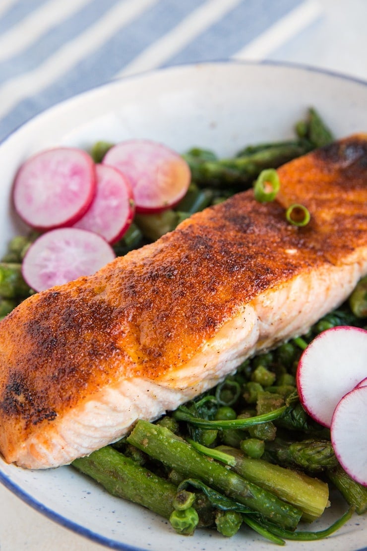 Spring Salmon Bowls with asparagus, peas, spinach, and radishes. A healthy, vibrant dinner recipe!