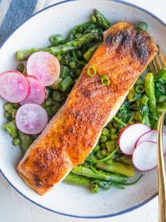 Spring Salmon Bowls with asparagus, peas, spinach, and radishes. A healthy, vibrant dinner recipe!