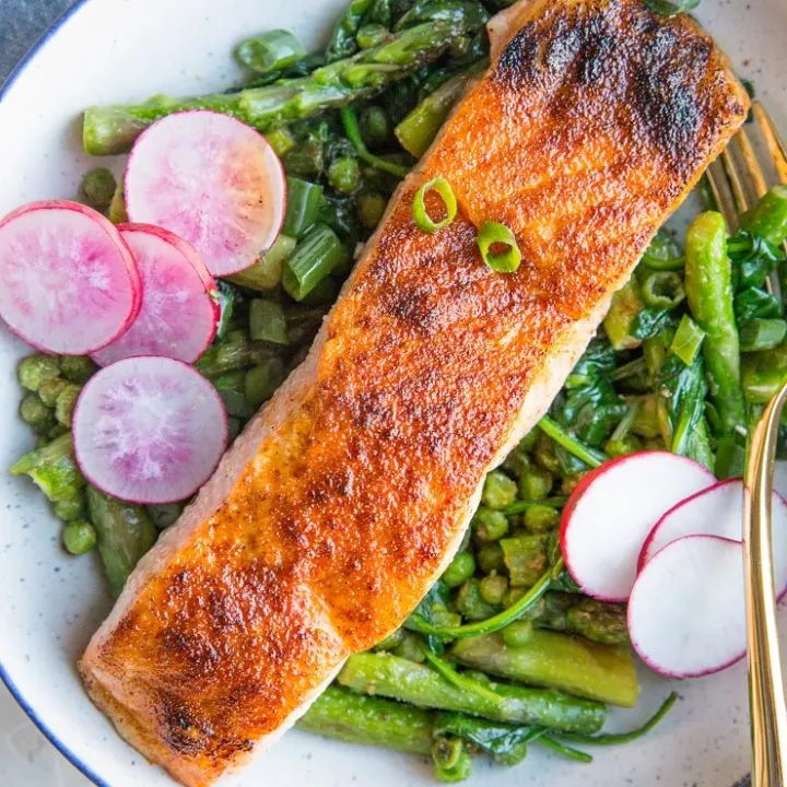 Spring Salmon Bowls with asparagus, peas, spinach, and radishes. A healthy, vibrant dinner recipe!