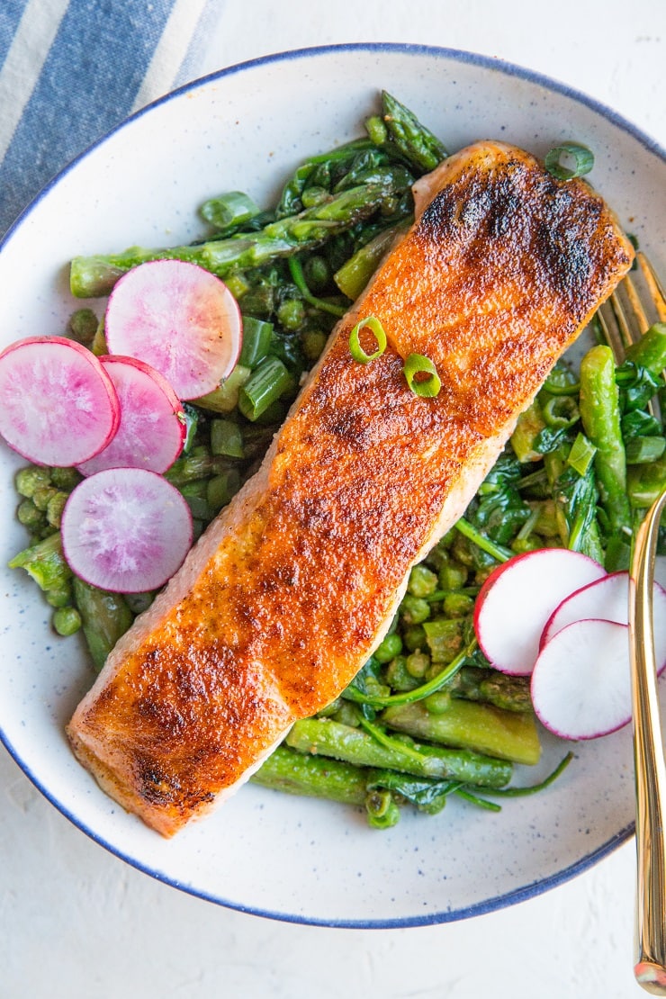 Spring Salmon Bowls with asparagus, peas, spinach, and radishes. A healthy, vibrant dinner recipe!