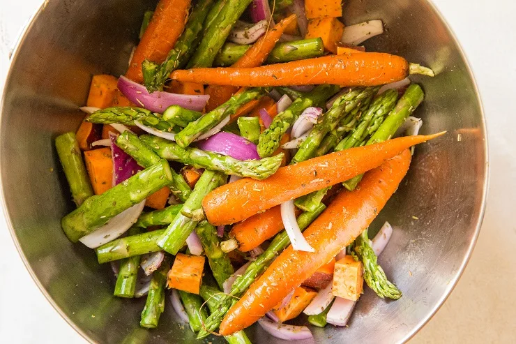 Mix vegetables in a mixing bowl with oil and seasoning
