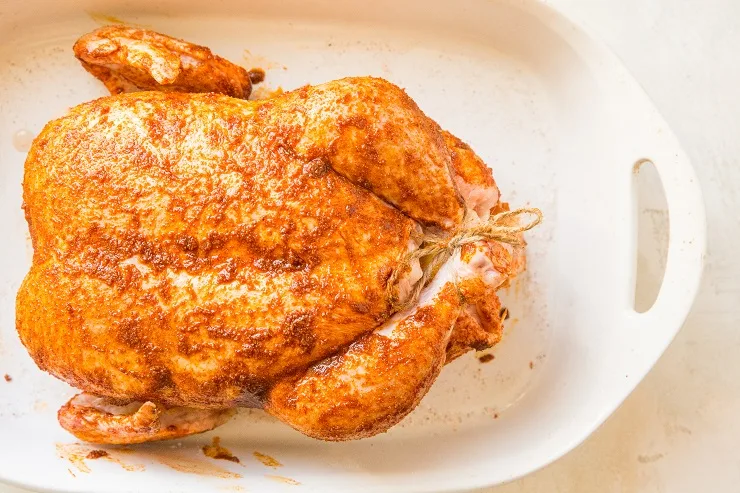Rub the chicken marinade all over the whole chicken