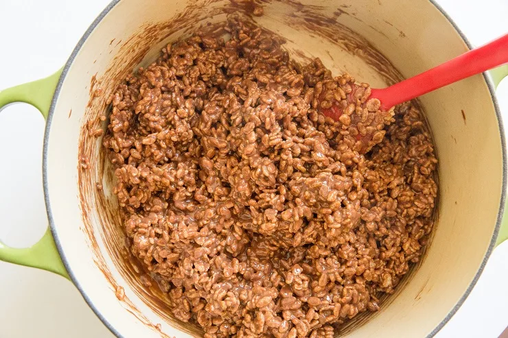 Ingredients for peanut butter no bake cookies stirred in a pot