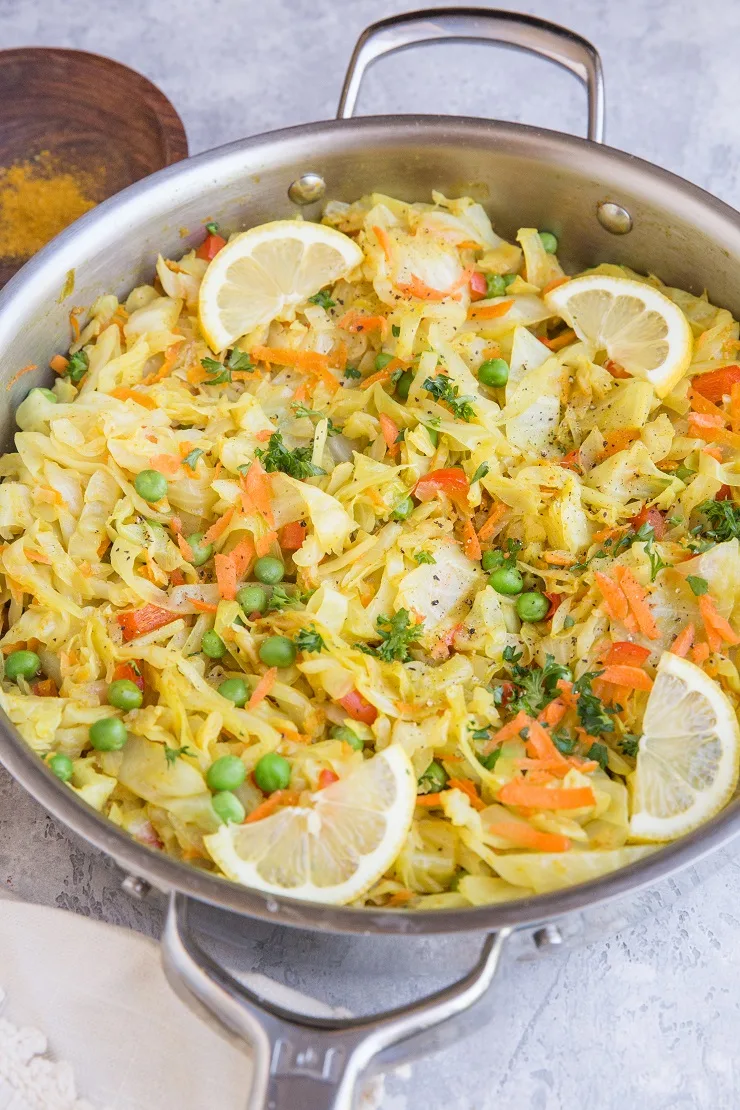 Curry Sautéed Cabbage with peas, carrots, and curry powder for an amazing side dish. Paleo, Vegan, whole30 and low-carb