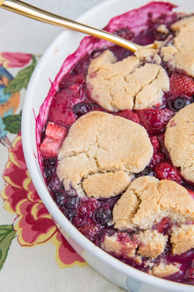 8-Ingredient Low-Carb Cobbler Recipe with mixed berries. Grain-free, sugar-free, dairy-free, and delicious!