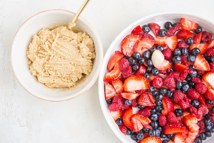 Transfer berries to a casserole dish and prepare cobbler topping