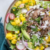 Instant Pot Shredded Beef Taco Salad with mango salsa, queso fresco, avocado and cilantro-lime dressing