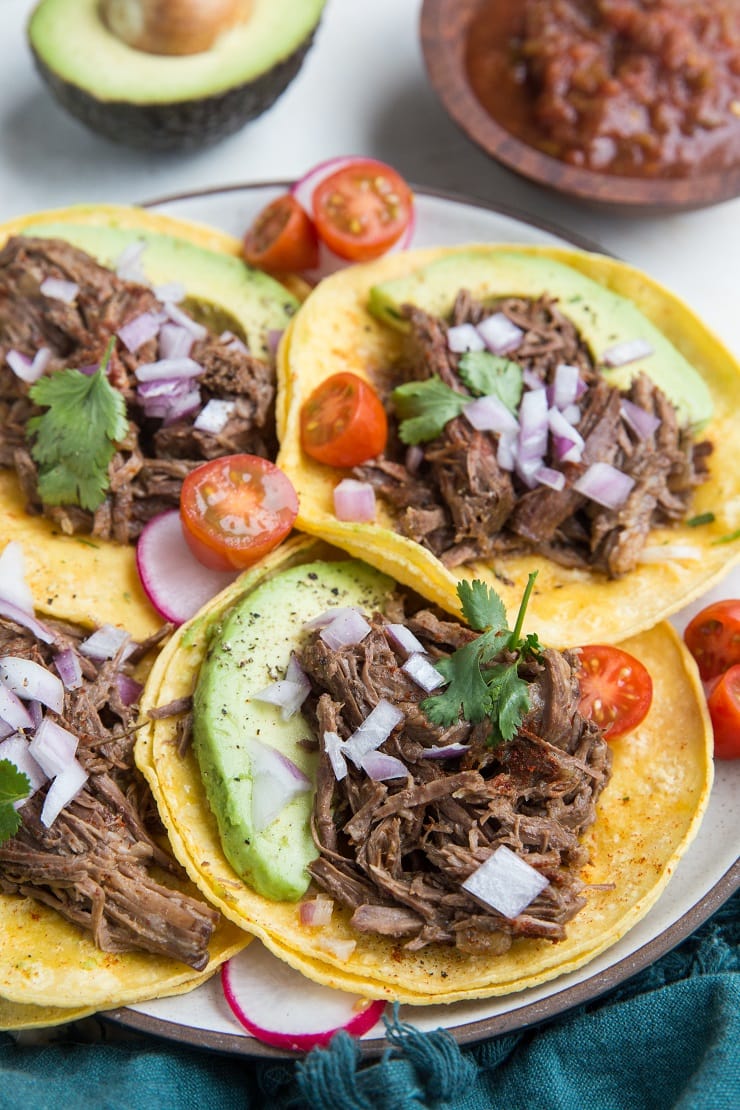 Instant Pot Shredded Beef Tacos - an easy beef taco recipe made in the pressure cooker. Perfect for any time of the year!