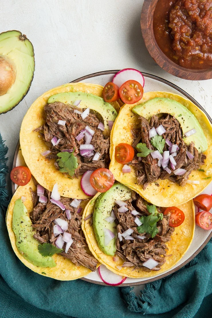 Instant Pot Shredded Beef Tacos are a magically flavorful and clean taco recipe. Super easy to make in the Instant Pot!