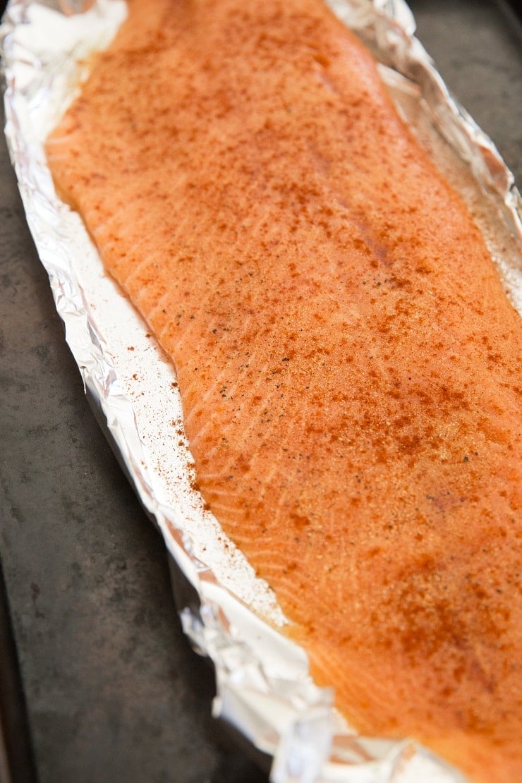 Season the salmon with garlic powder, paprika, and sea salt