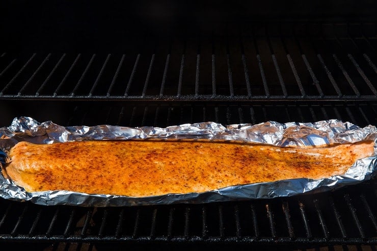 Salmon smoking on a smoker