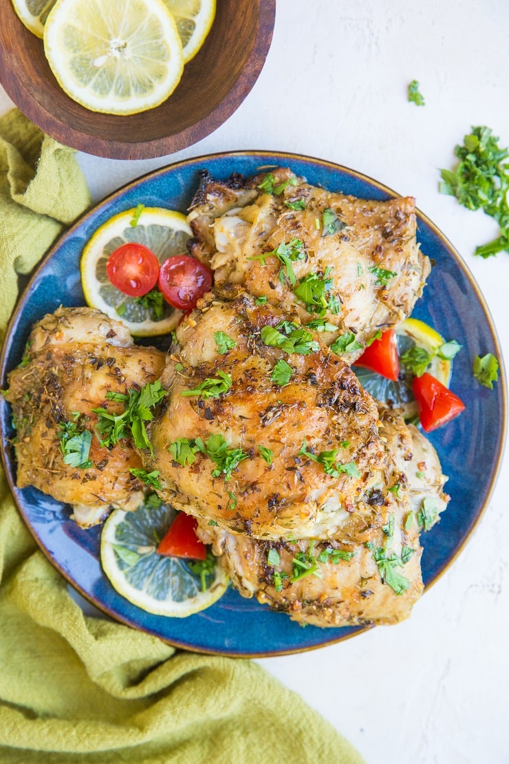 Greek Chicken recipe with a fresh lemon herb marinade. Tasty baked chicken ideal for weeknight meals or meal prep.