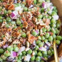 Mayo-Free Pea Salad with dried cranberries, bacon, pecans, red onion for a delicious summer side dish for any picnic or barbecue