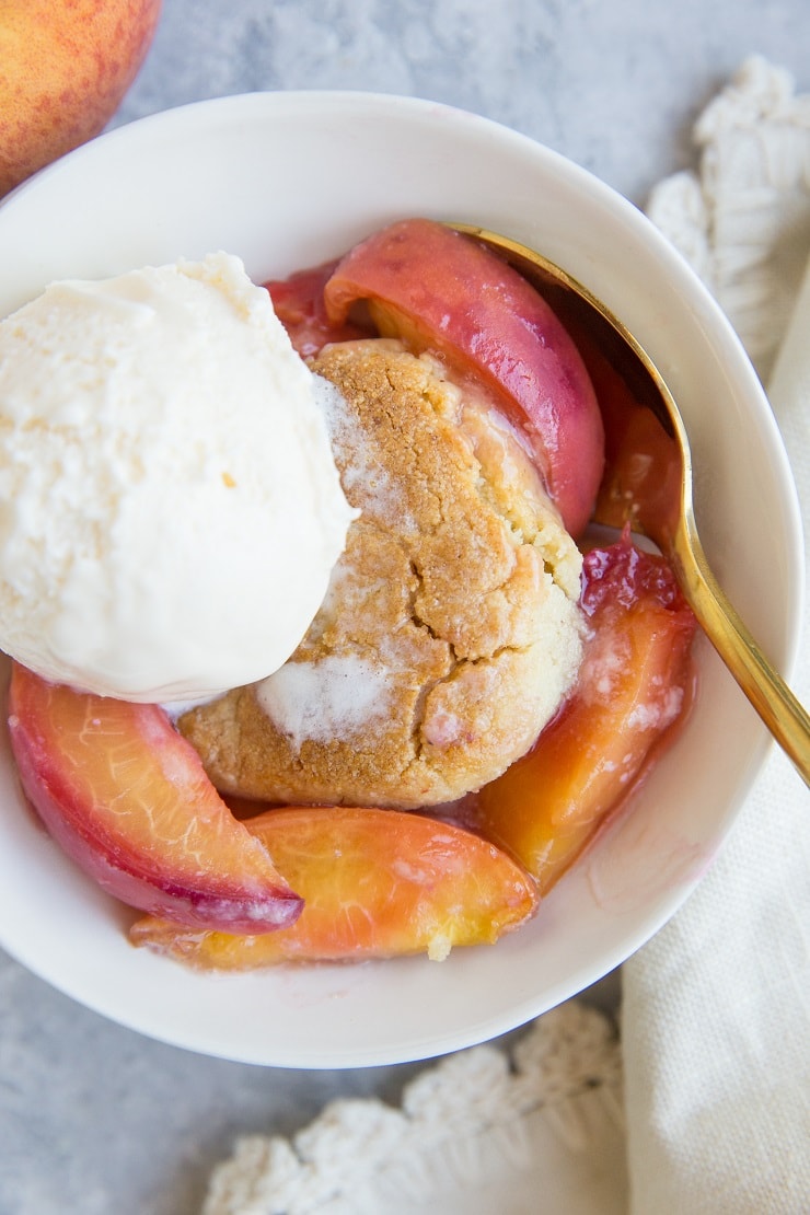 Vegan Paleo Peach Cobbler with almond flour topping - this easy summer dessert recipe is grain-free, refined sugar-free, dairy-free and magically delicious!