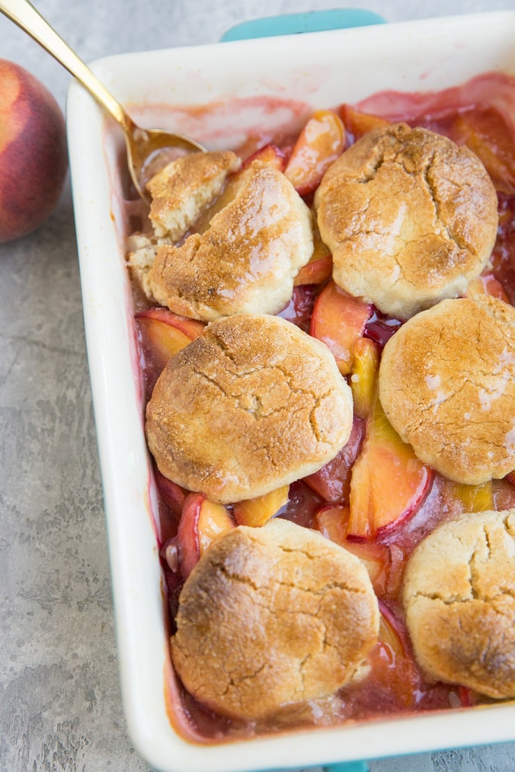 Vegan Paleo Peach Cobbler with almond flour topping - this easy summer dessert recipe is grain-free, refined sugar-free, dairy-free and magically delicious!