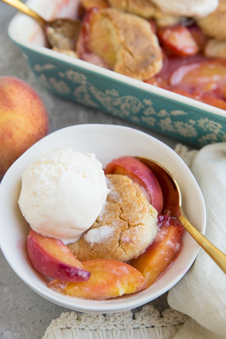 Vegan and Grain-Free Peach Cobbler made with paleo almond flour biscuit topping. Gluten-free, refined sugar-free, dairy-free