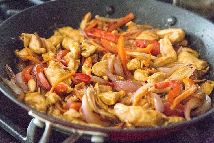 Add the stir fry vegetables back into the skillet with the chicken