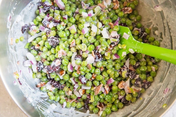 Pea Salad mixed up in a mixing bowl