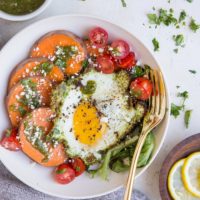 Pesto Eggs Breakfast Bowls with sweet potato, greens, cherry tomatoes and feta is a delicious and nourishing way to start the day!
