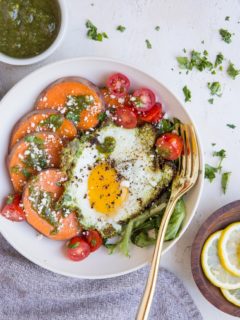 Pesto Eggs Breakfast Bowls with sweet potato, greens, cherry tomatoes and feta is a delicious and nourishing way to start the day!