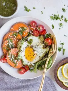 Pesto Eggs Breakfast Bowls with sweet potato, greens, cherry tomatoes and feta is a delicious and nourishing way to start the day!