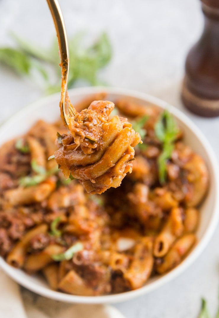 A bite of rigatoni with meat sauce