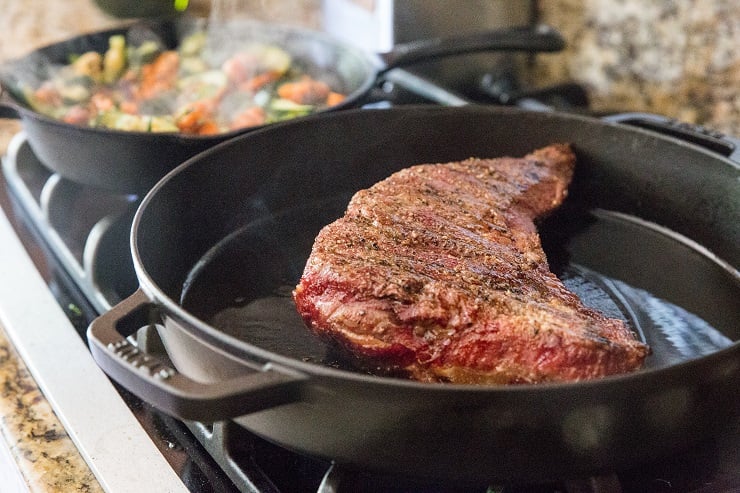 Sear smoked tri tip in a cast iron skillet to get an outer crust