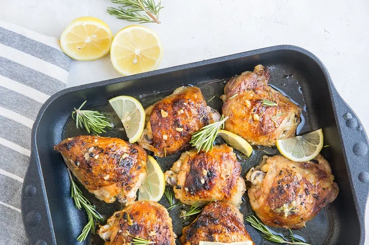 Lemon Garlic Rosemary Baked Chicken Recipe - deliciously zesty and herby baked chicken thighs are fall-off-the-bone delicious!