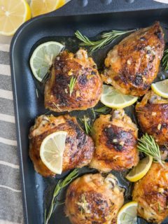 Easy Baked Garlic Lemon Rosemary Chicken - fall-off-the-bone tender delicious chicken thighs with perfect crispy skin - a simple yet magnificently flavorful dinner