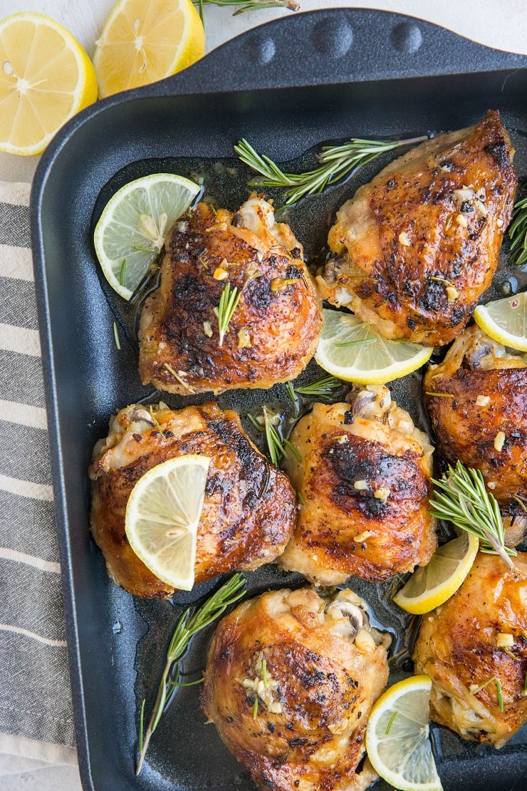 Easy Baked Garlic Lemon Rosemary Chicken - fall-off-the-bone tender delicious chicken thighs with perfect crispy skin - a simple yet magnificently flavorful dinner