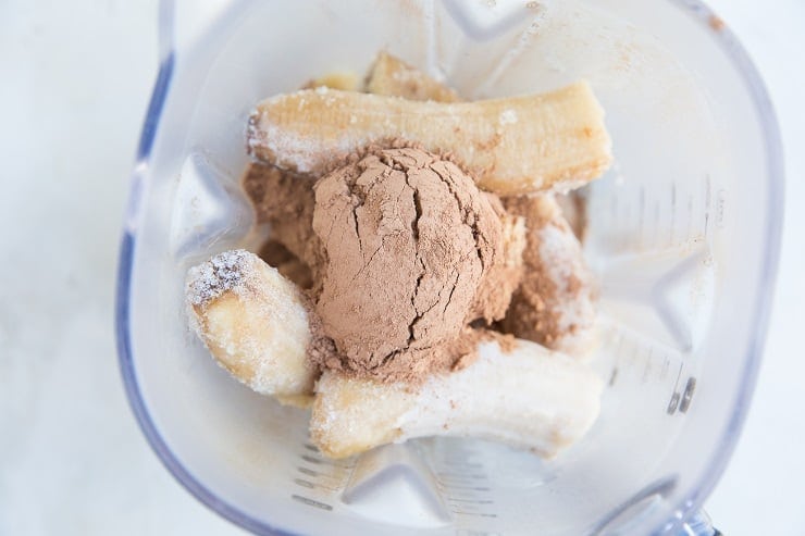 Ingredients for banana chocolate ice cream in a blender