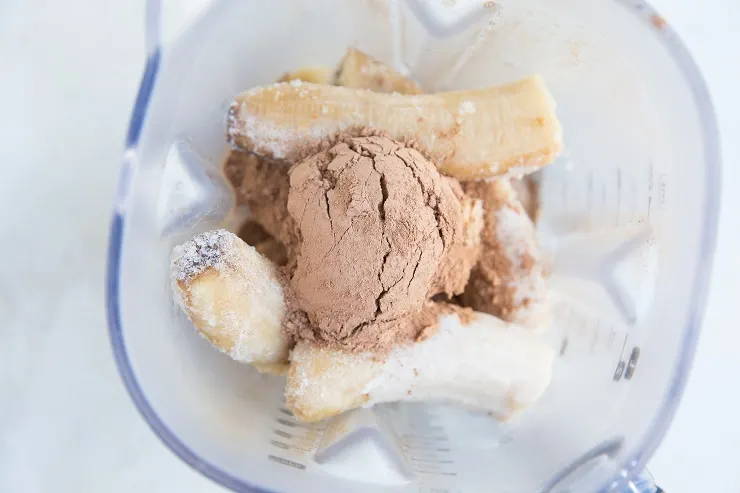 Ingredients for banana chocolate ice cream in a blender