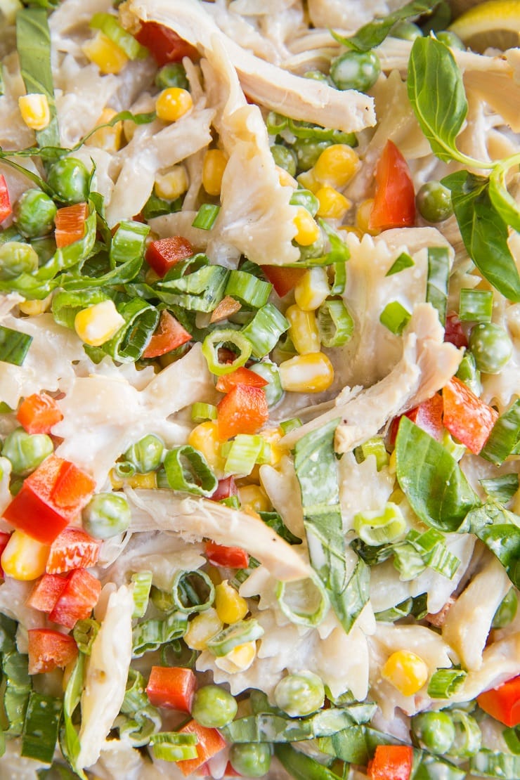 Creamy mayo-free Chicken Pasta Salad with corn, bell pepper, peas, and a lemony Greek yogurt dressing. Light and refreshing