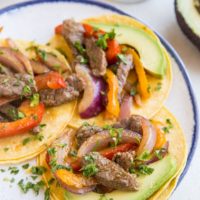 Quick & Easy Steak Fajitas made with only a few basic ingredients. These incredibly flavorful fajitas can be used in tacos, burritos, burrito bowls, and more!