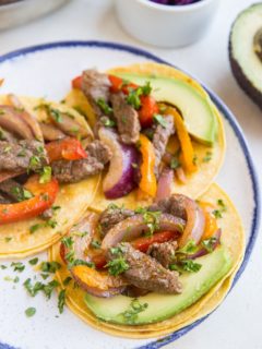 Quick & Easy Steak Fajitas made with only a few basic ingredients. These incredibly flavorful fajitas can be used in tacos, burritos, burrito bowls, and more!
