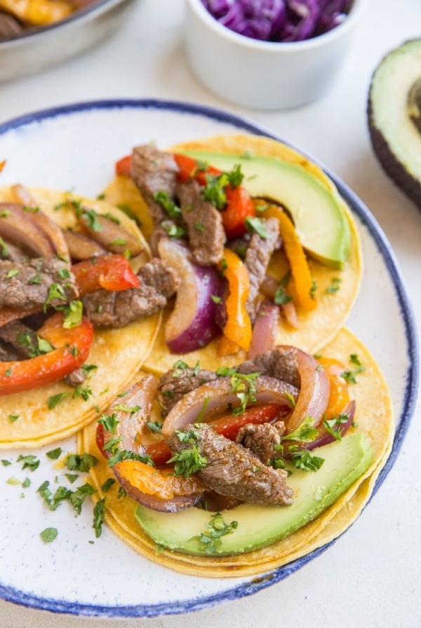 Quick & Easy Steak Fajitas made with only a few basic ingredients. These incredibly flavorful fajitas can be used in tacos, burritos, burrito bowls, and more!