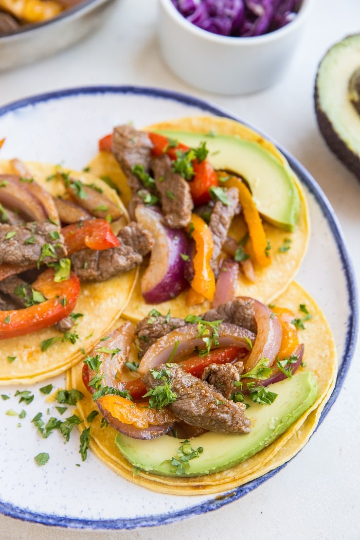 Quick & Easy Steak Fajitas made with only a few basic ingredients. These incredibly flavorful fajitas can be used in tacos, burritos, burrito bowls, and more!