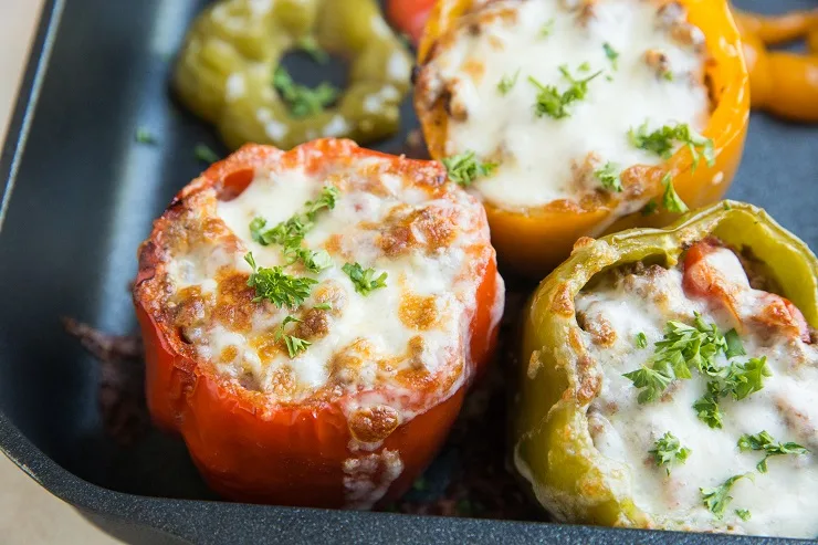 Quick, easy 10-ingredient Stuffed Peppers with ground beef, tomatoes and rice. A delicious healthier dinner recipe