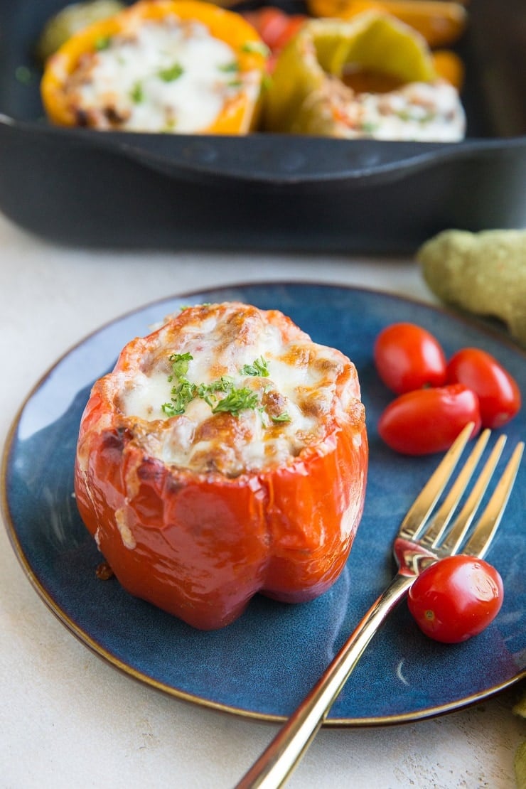 Easy Healthy Stuffed Peppers with ground beef and rice. Taco-style stuffed bell peppers are easy to prepare and so fun to make!
