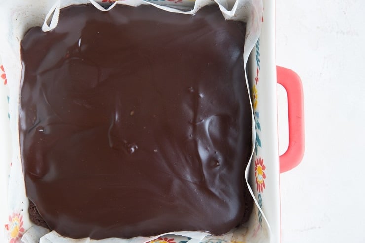 Finished brownies with ganache in a baking pan