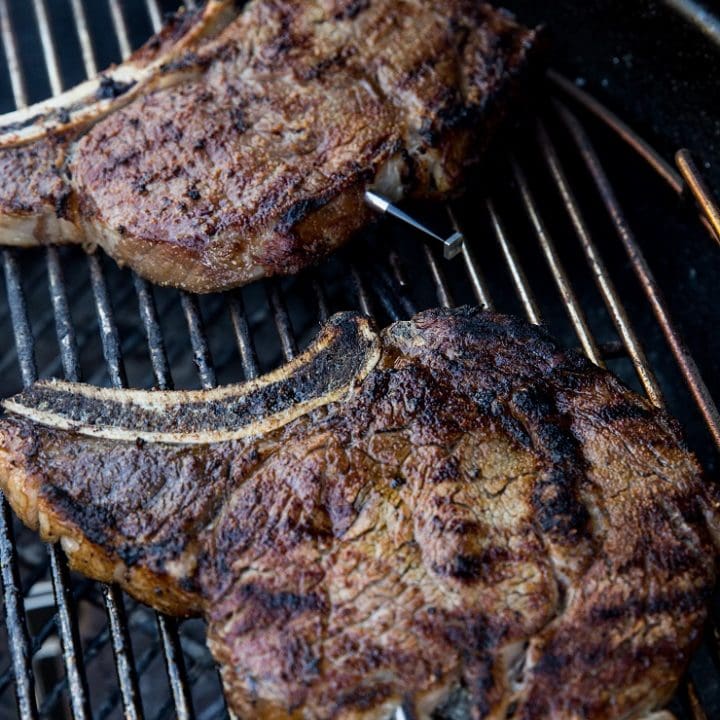 Grilled ribeye steaks on a grill
