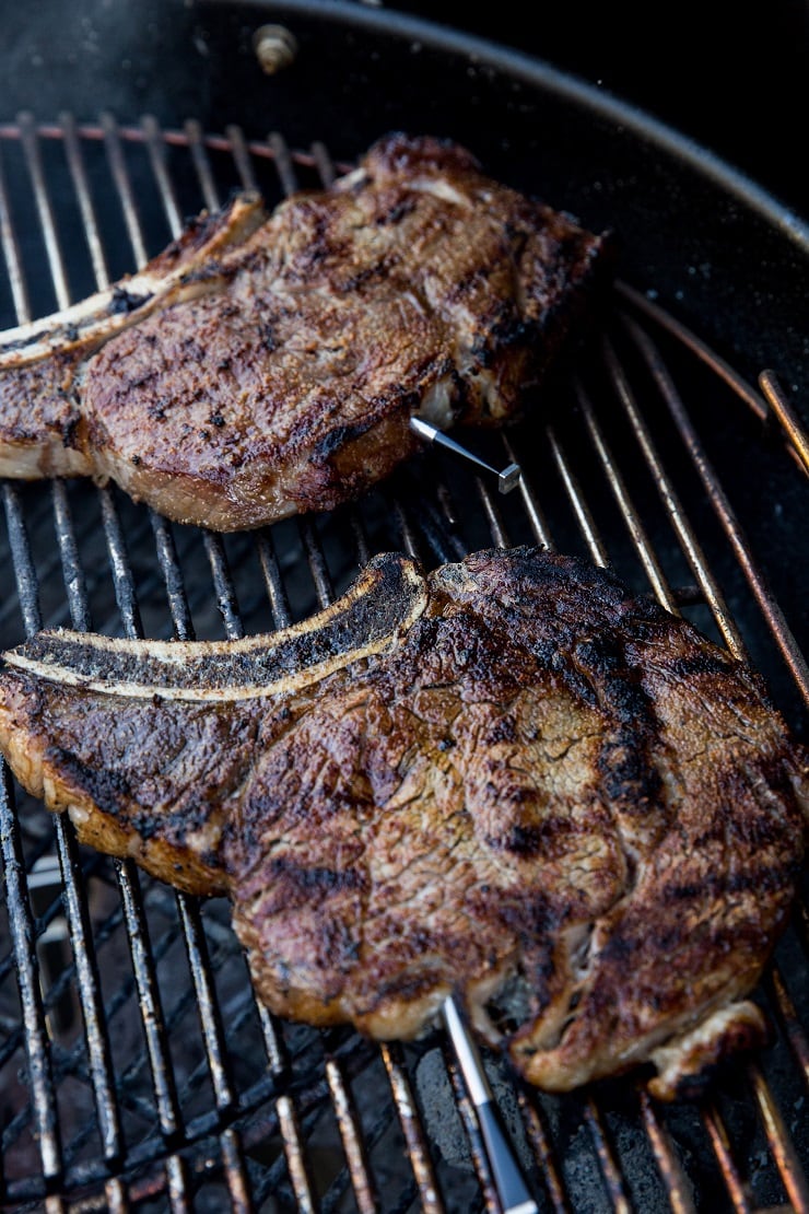 Grilled ribeye steaks on a grill