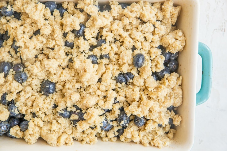 Crumble the topping over the blueberries