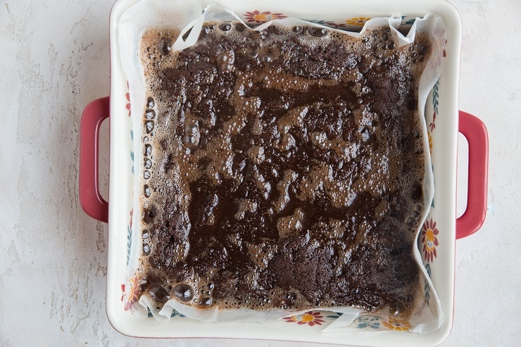 keto brownies with butter coming out around the edges