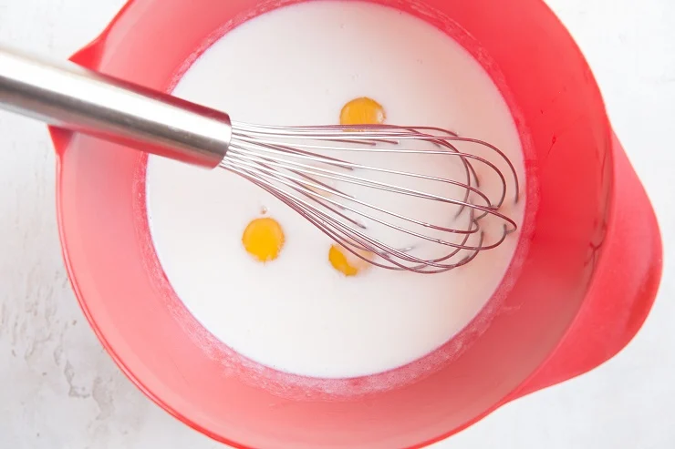 Whisk together the liquids for the pancakes in a mixing bowl