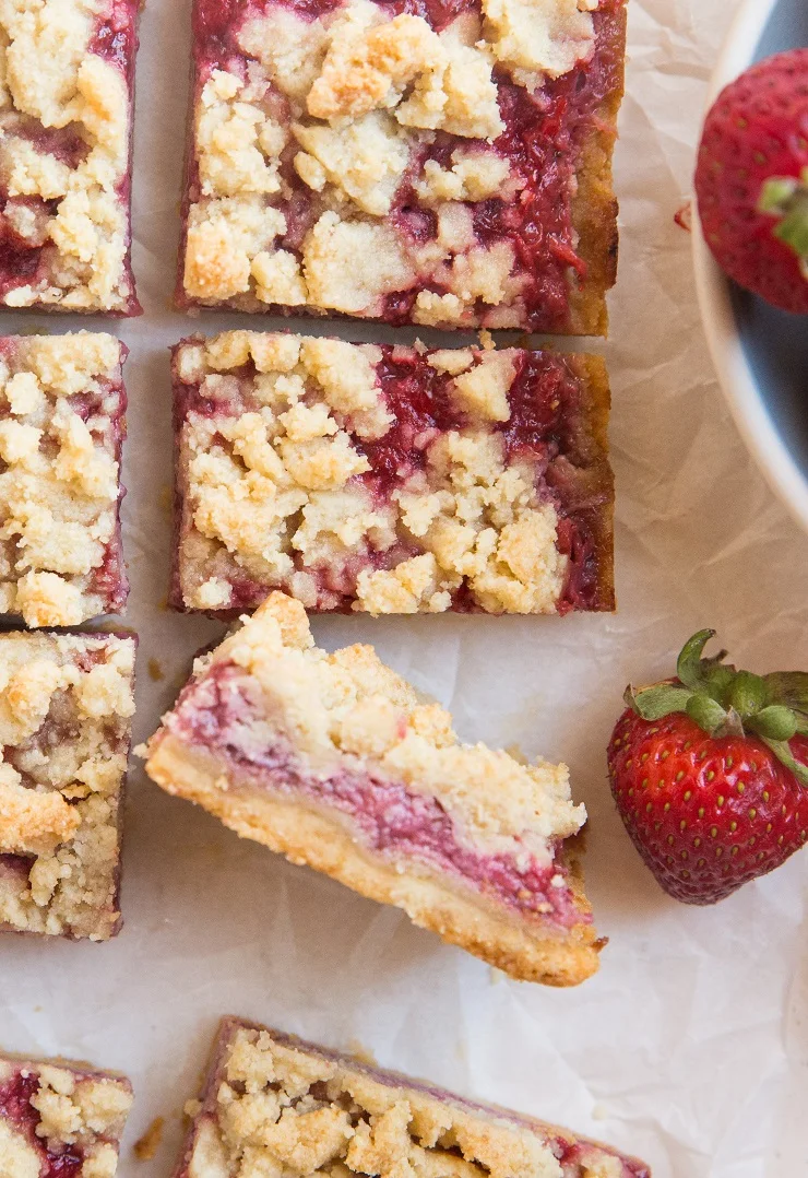 Beautifully buttery Keto Strawberry Crumb Bars on a grain-free shortbread crust are magically flaky with the perfect sweet, tangy gooey strawberry bite. This incredibly easy recipe only requires 5 basic ingredients! Egg-free and easy to make dairy-free for a vegan option!