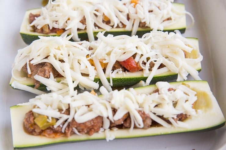 Stuff the zucchini with ground beef taco mixture and sprinkle with cheese