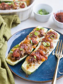 Taco Stuffed Zucchini Boats with ground beef and all the delicious taco seasonings. Easy, quick, low-carb, delicious!