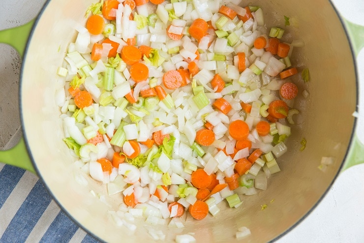 onion, celery, garlic, and carrots in a pot